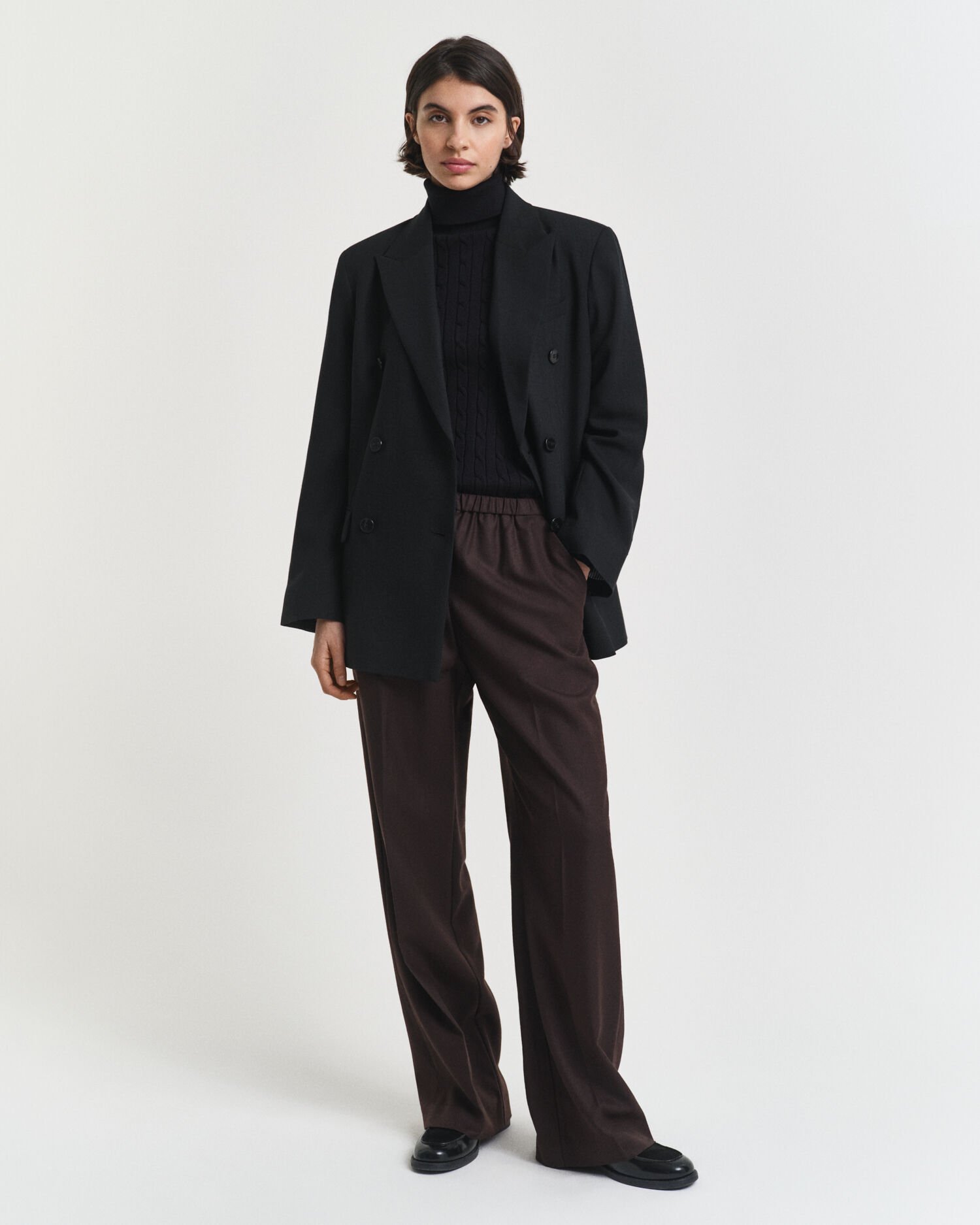 Maglia a collo alto in cotone elasticizzato a trecce