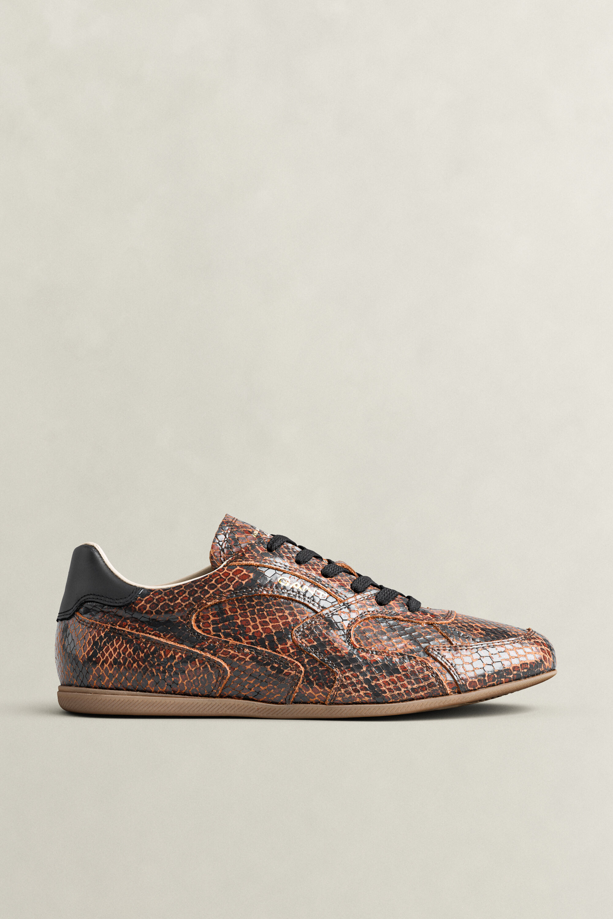 Sneakers Spelly in pelle con effetto serpente