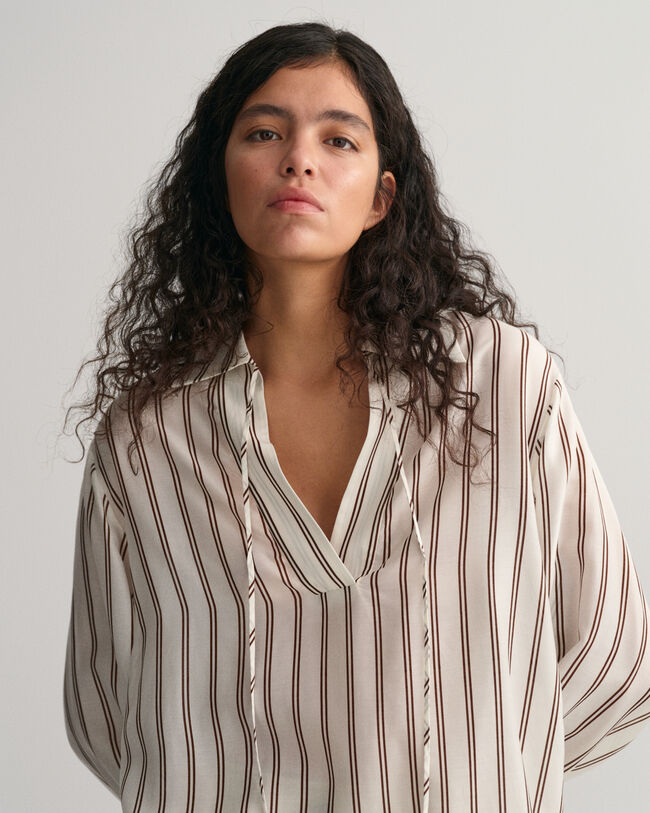 Blusa con scollo a V a righe