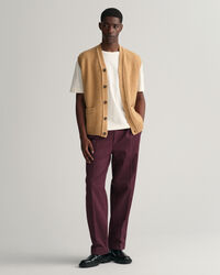 Piumino smanicato in morbida lana con abbottonatura