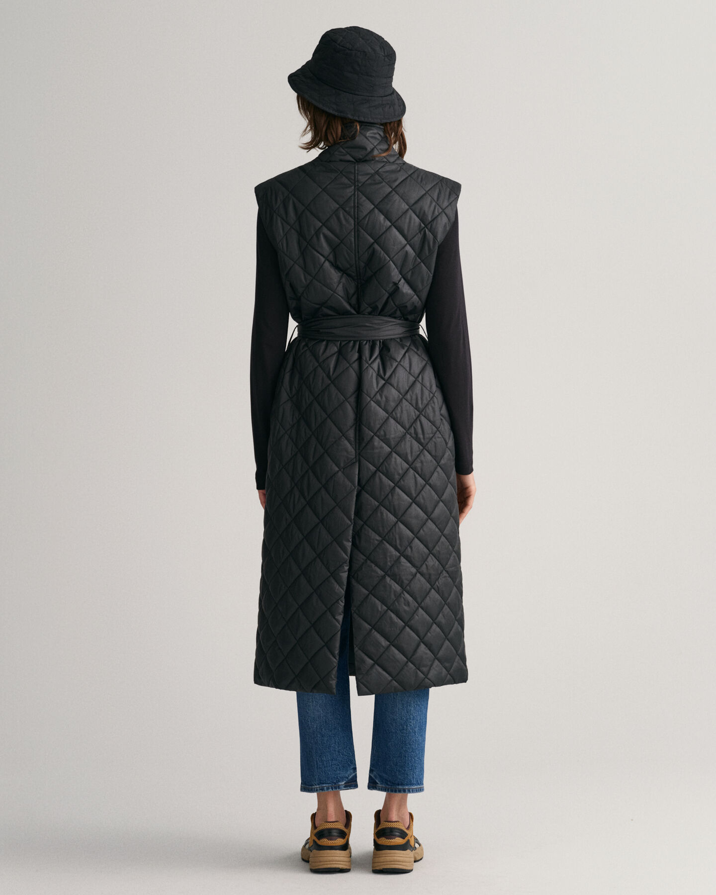 Piumino smanicato trapuntato lungo