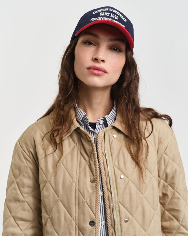 Piumino trapuntato con dettagli in velluto a coste