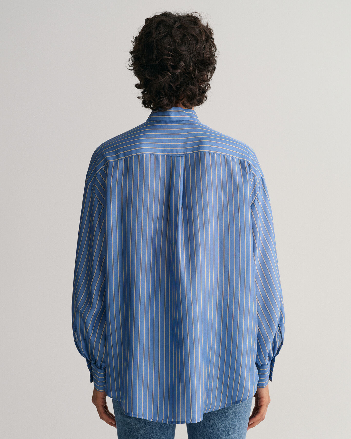 Blusa a righe in seta con fiocco