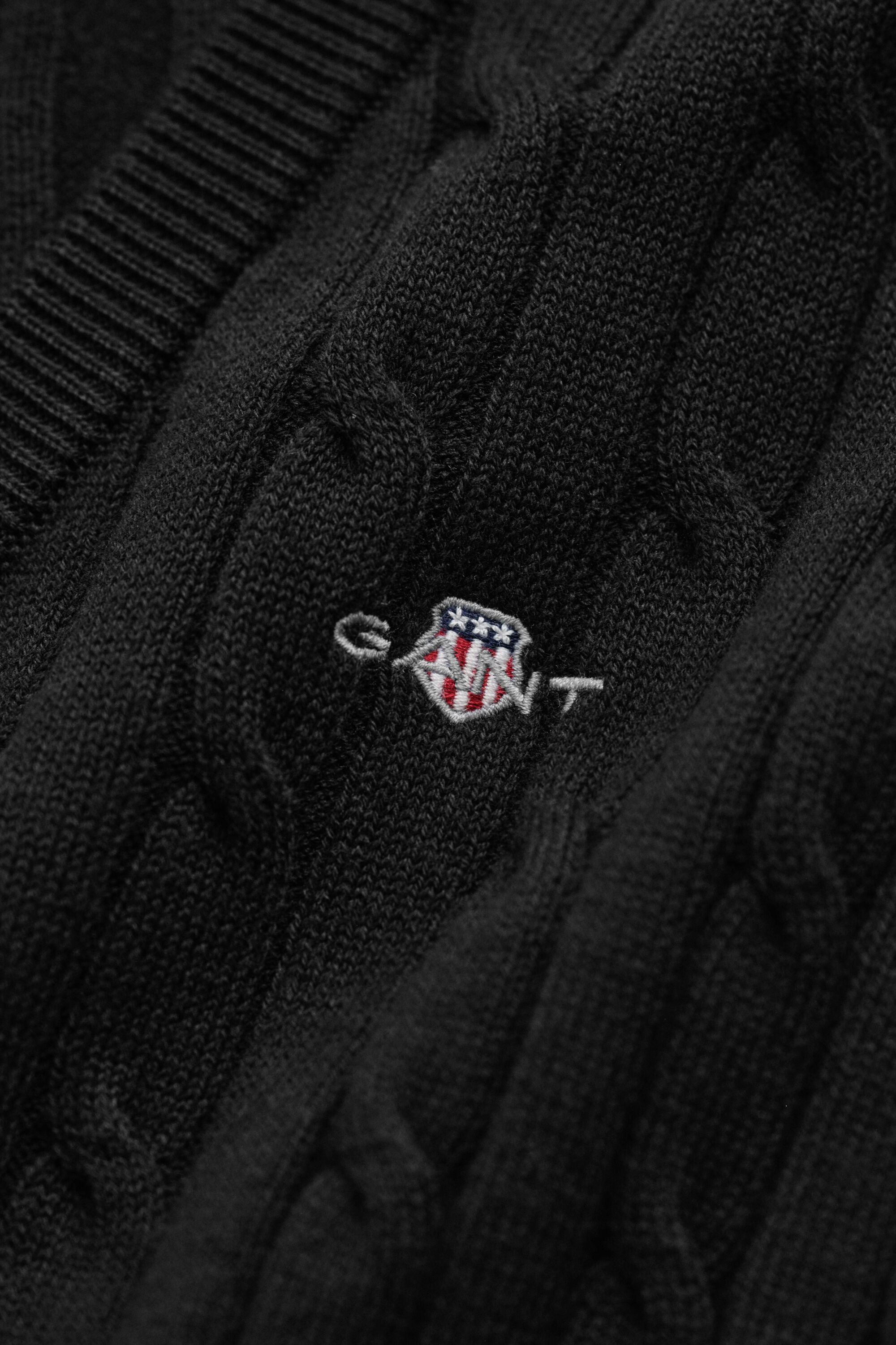 Maglia con scollo a V in cotone elasticizzato a trecce