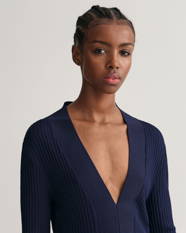 Top a maniche lunghe a righe con scollo a V