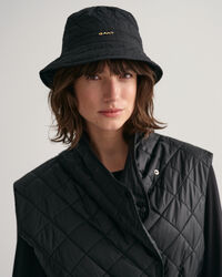 Piumino smanicato trapuntato lungo