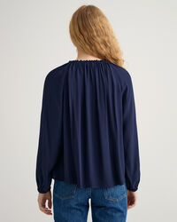 Blusa con scollo a barchetta
