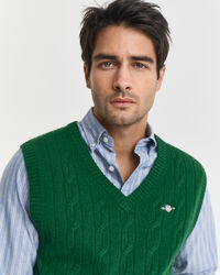 Piumino smanicato a trecce in morbida lana d’agnello