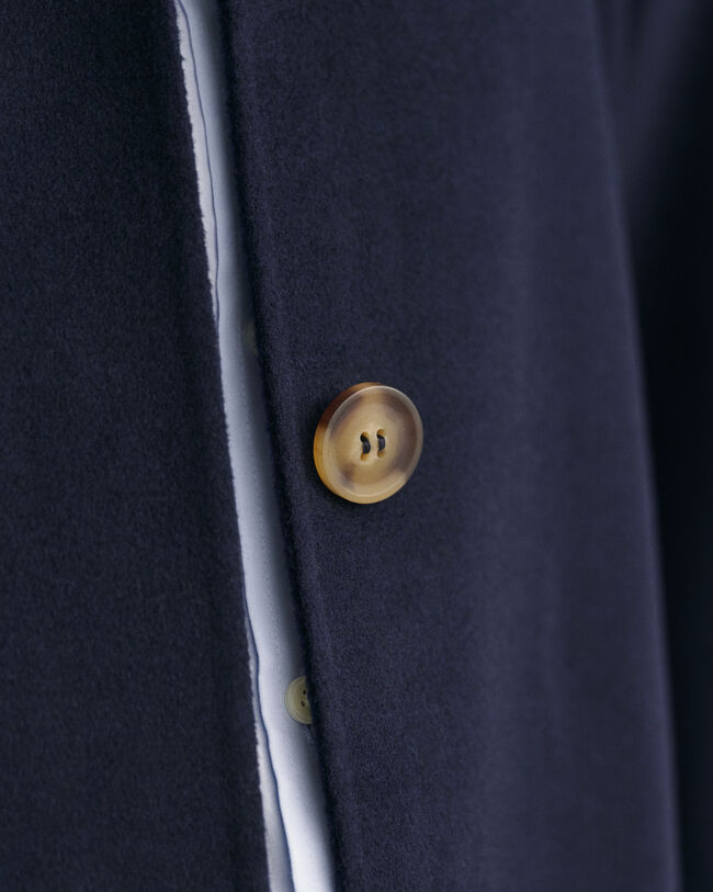 Impermeabile cucito a mano