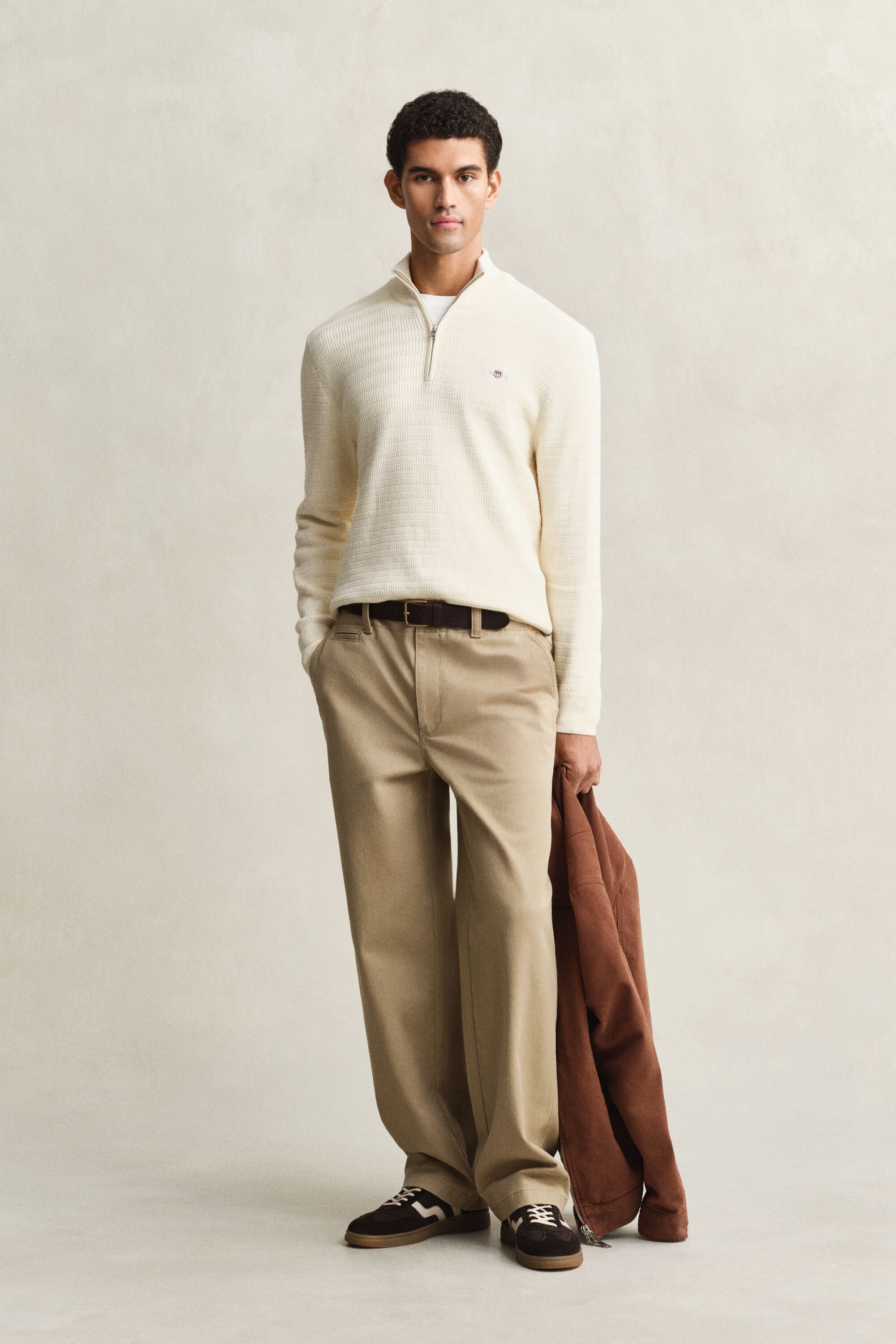 Maglia con zip corta a mini trecce