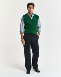 Piumino smanicato a trecce in morbida lana d’agnello