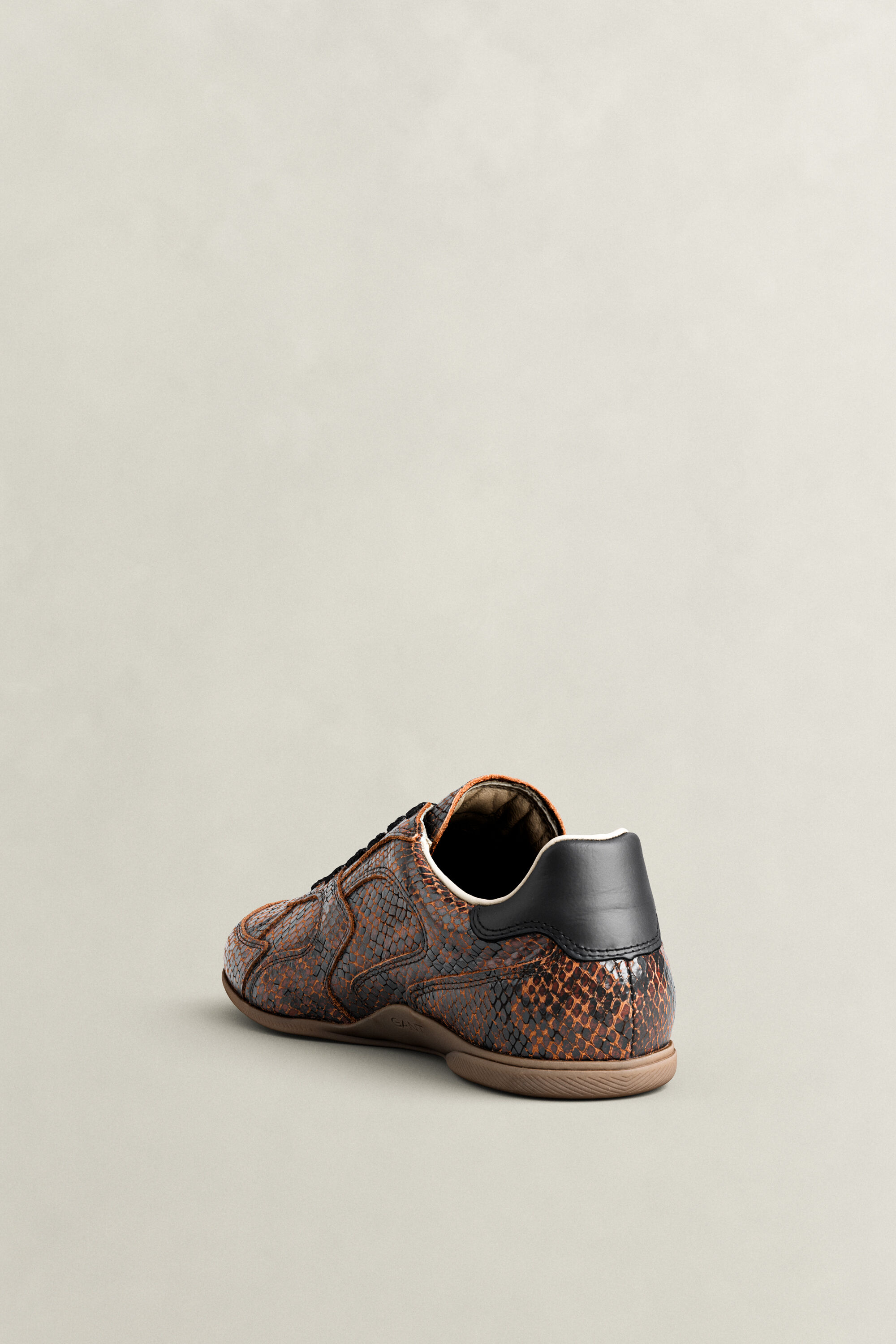 Sneakers Spelly in pelle con effetto serpente