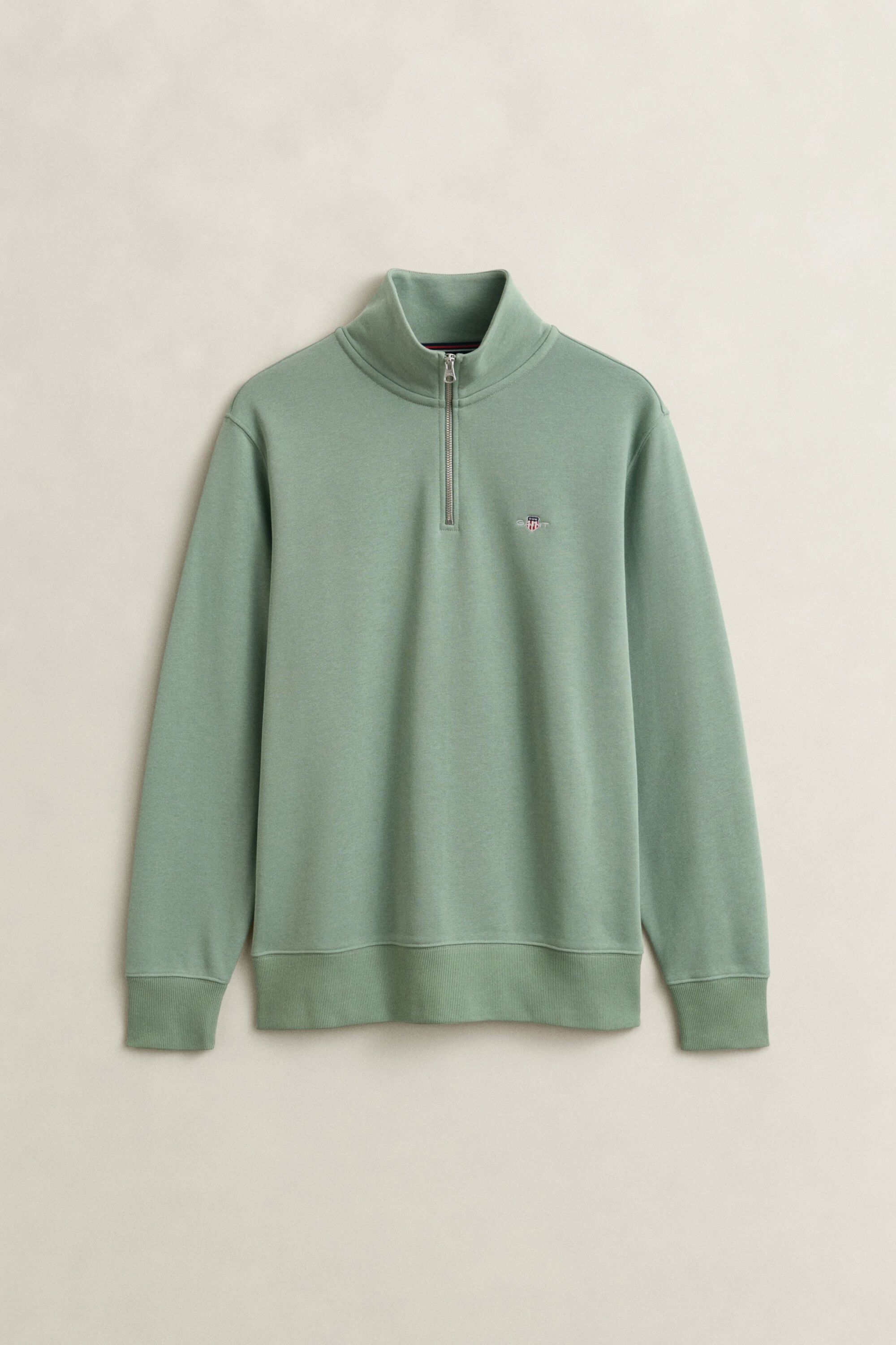 Felpa Shield con zip corta