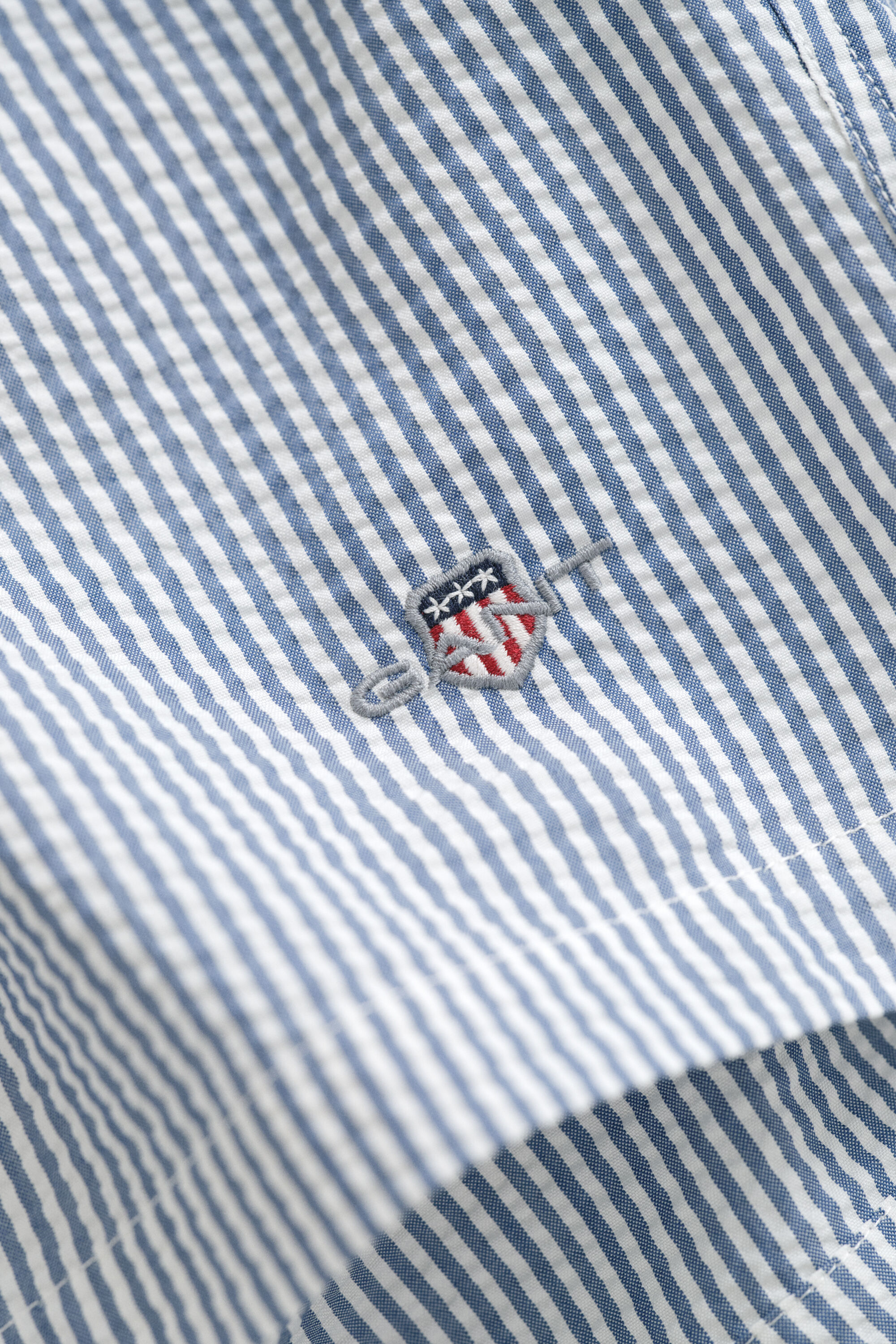 Pantaloncini da bagno in seersucker a righe