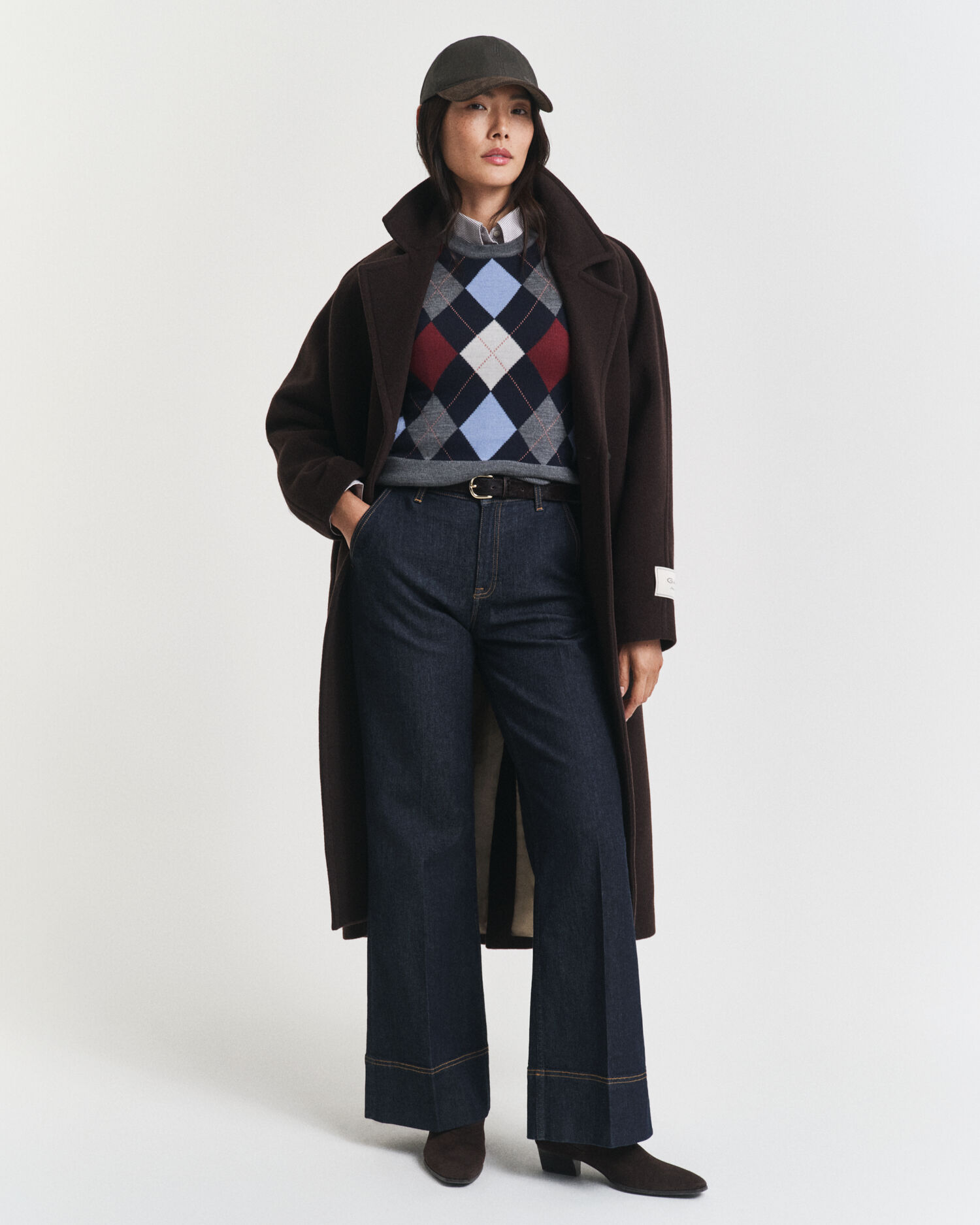 Piumino smanicato girocollo a rombi