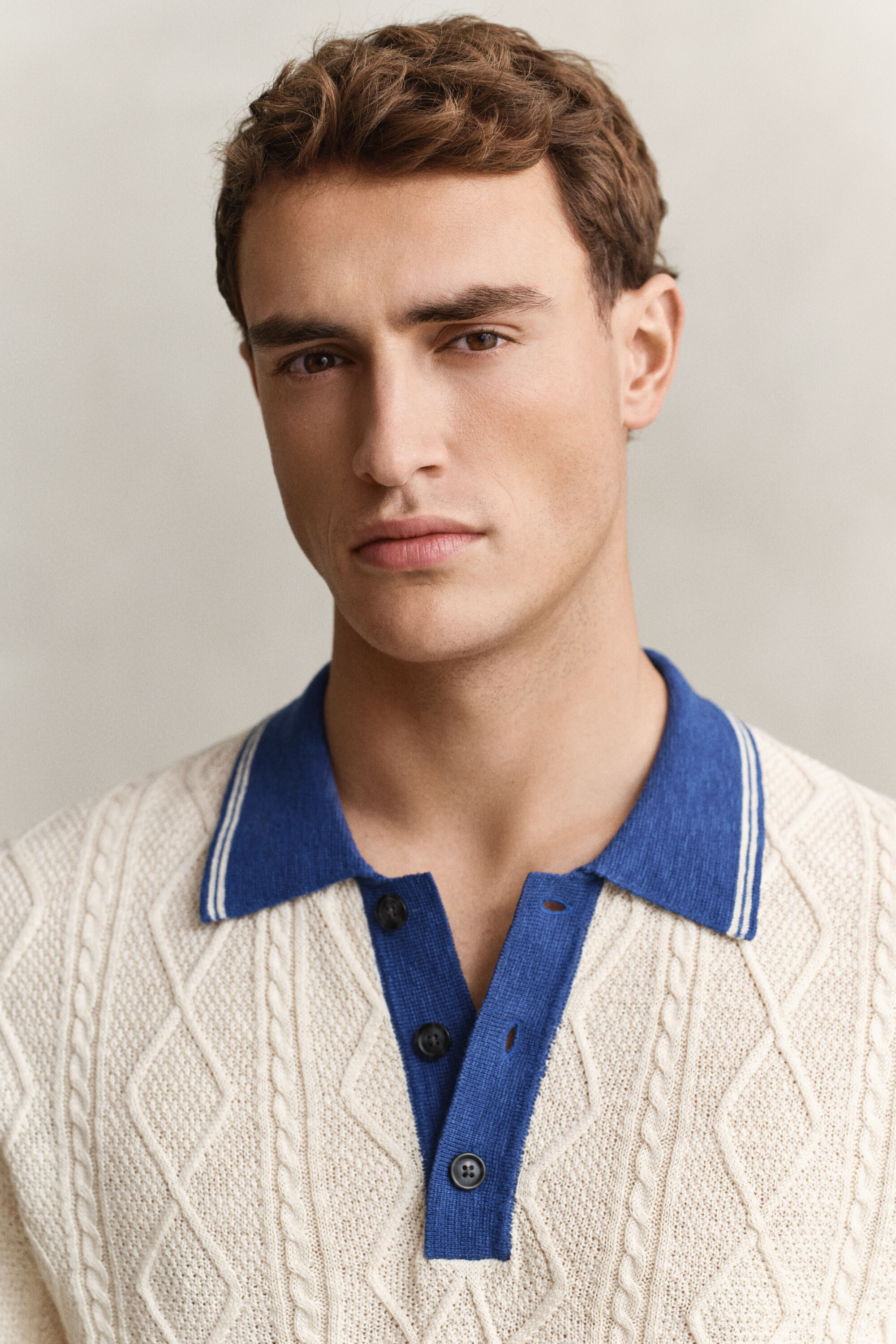 Polo in maglia a trecce