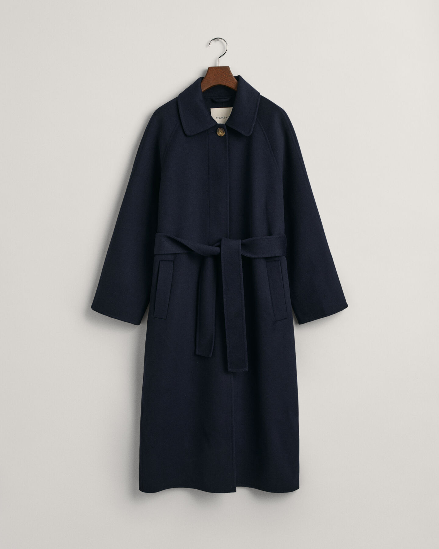 Impermeabile cucito a mano