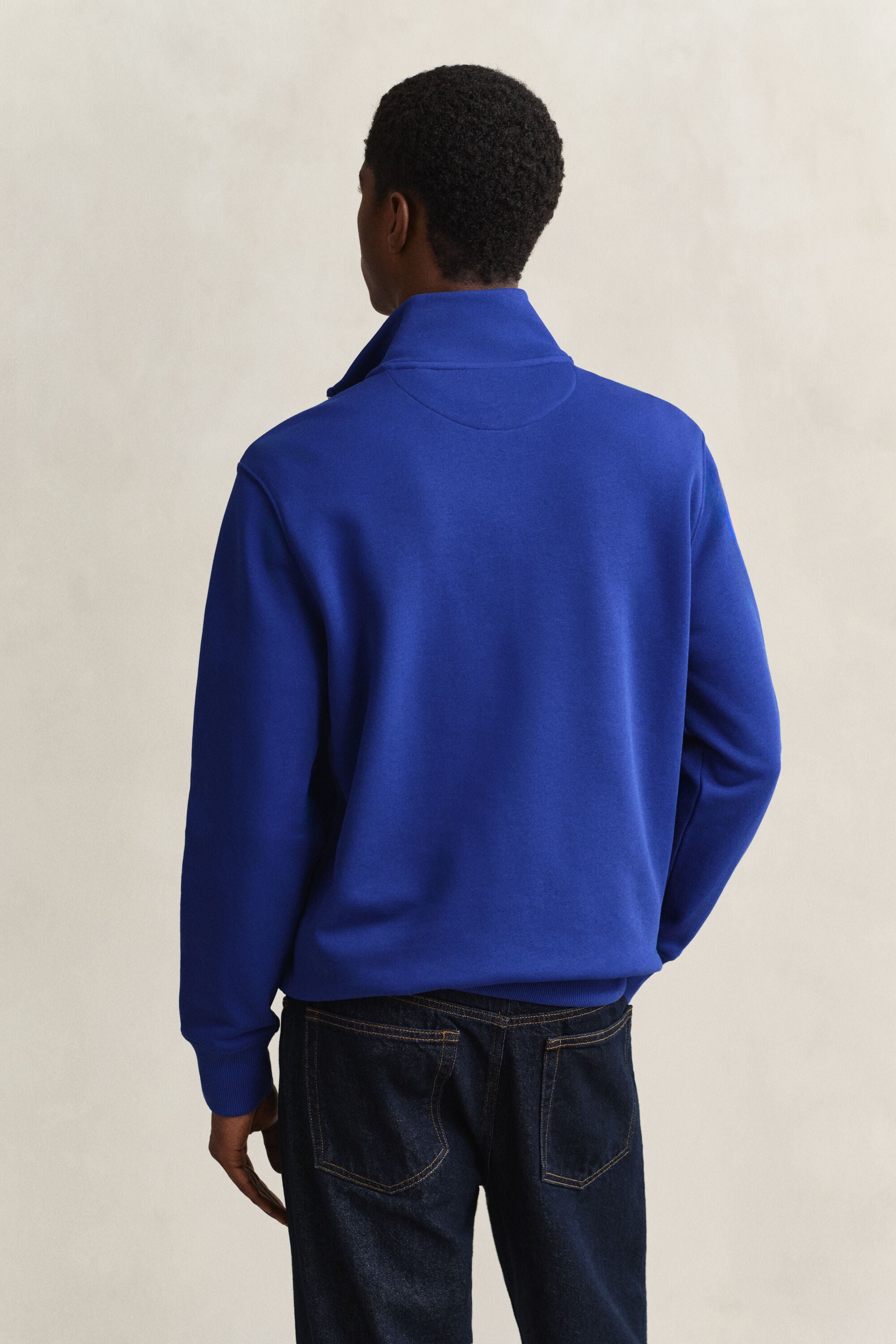 Felpa Shield con zip corta