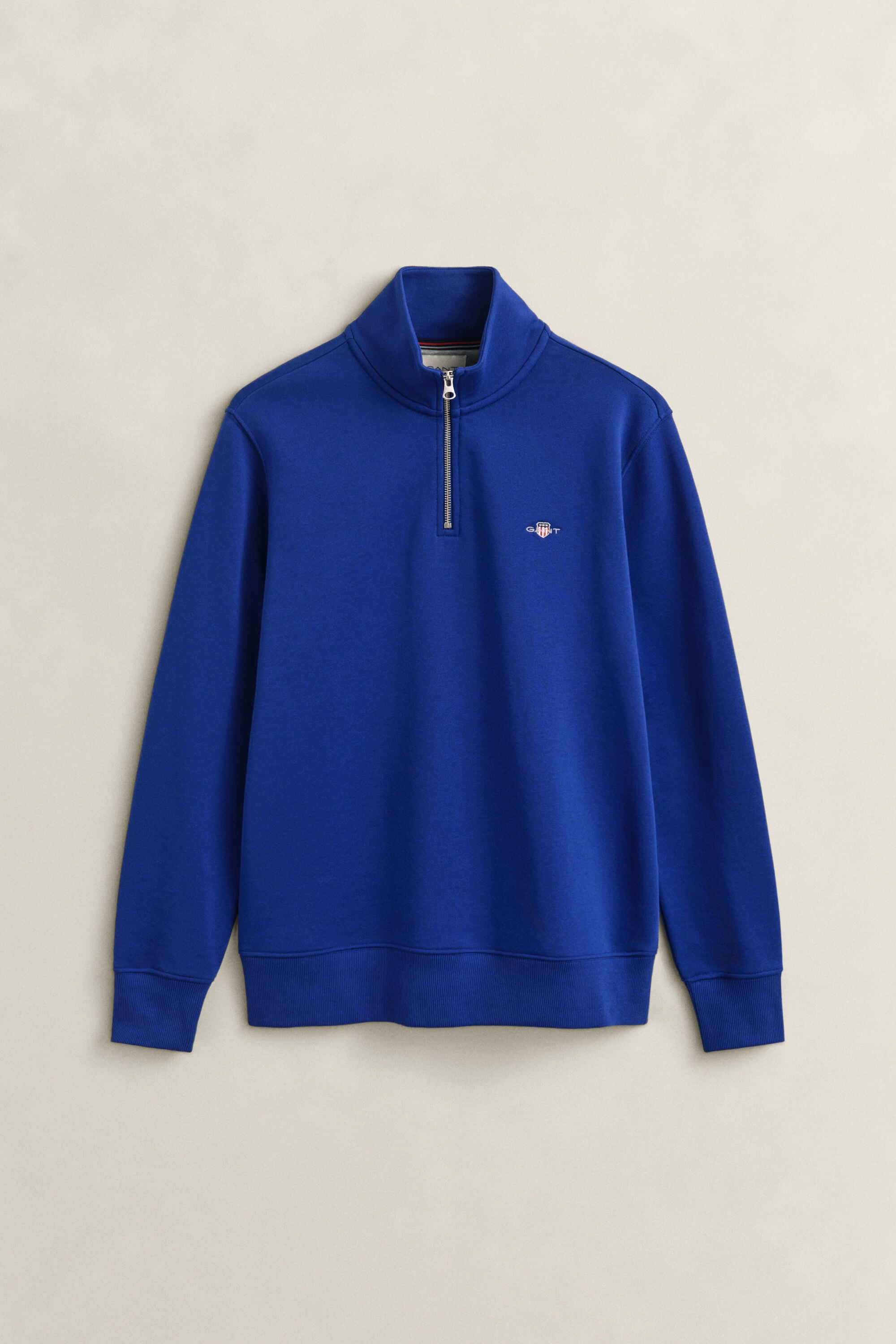 Felpa Shield con zip corta