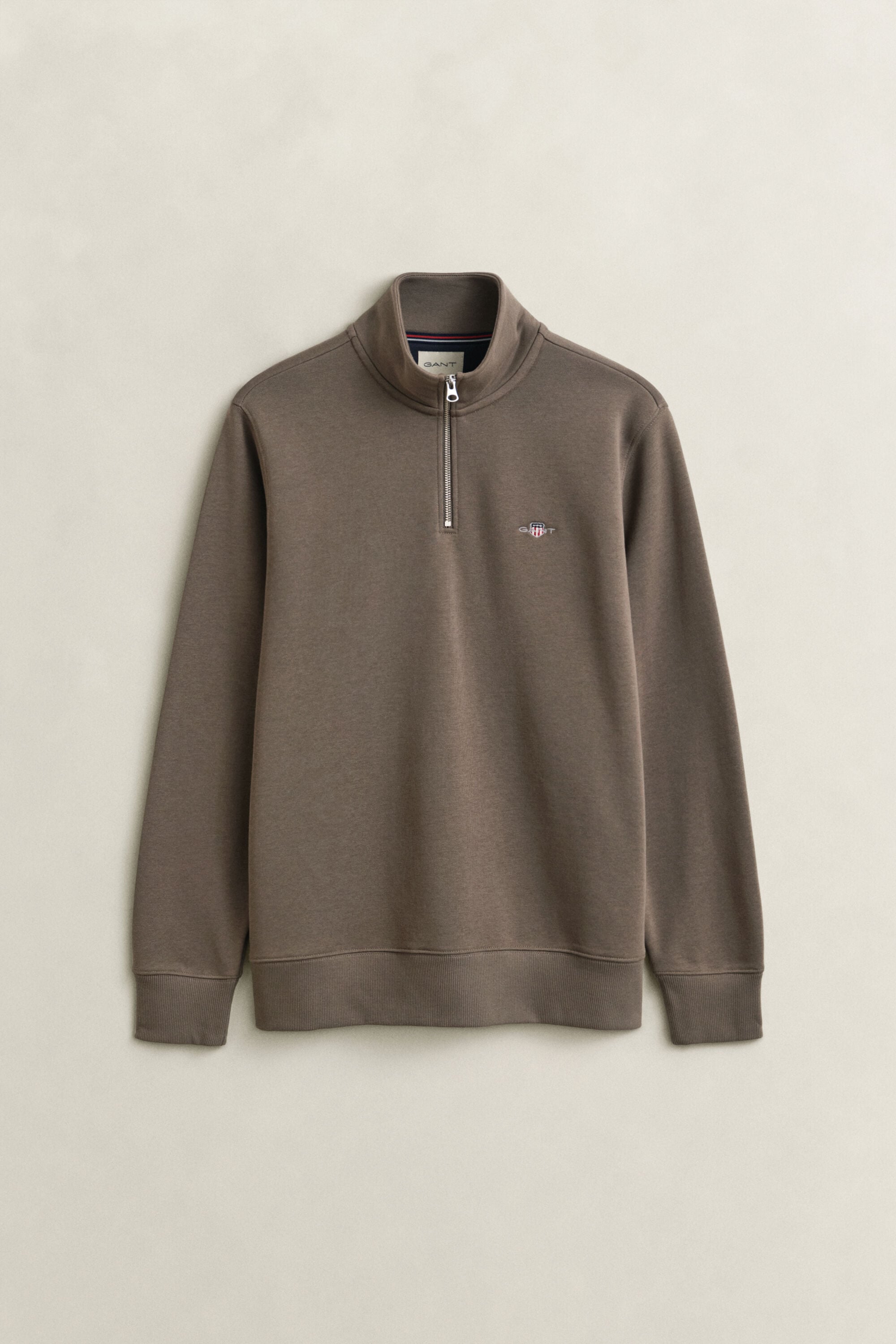 Felpa Shield con zip corta