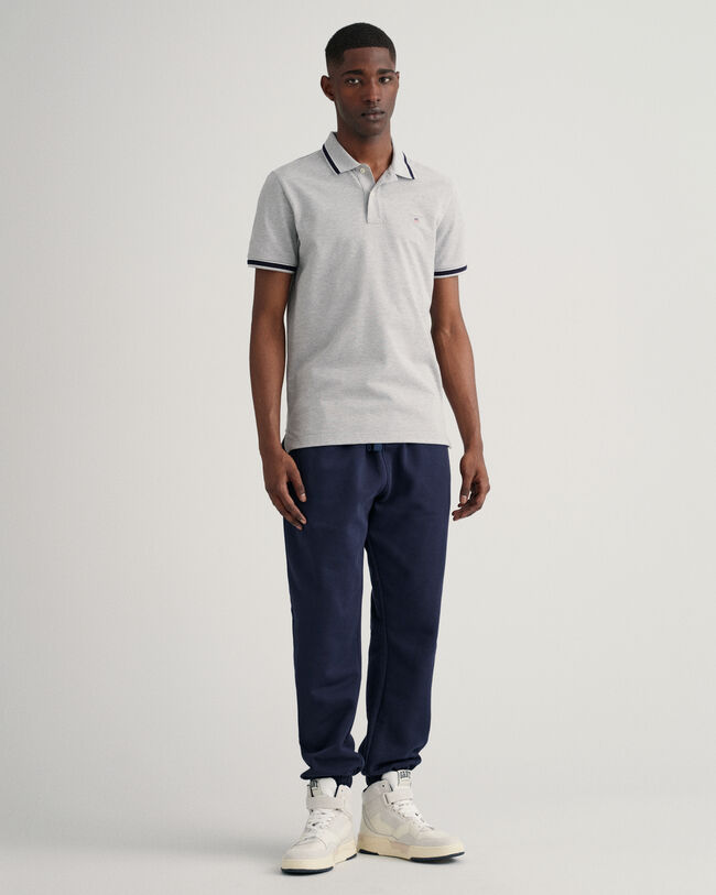 Polo in piqu&eacute; con bordino a spina di pesce