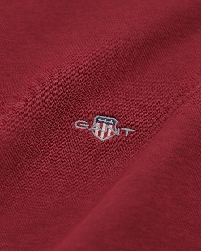 Felpa Shield con zip corta